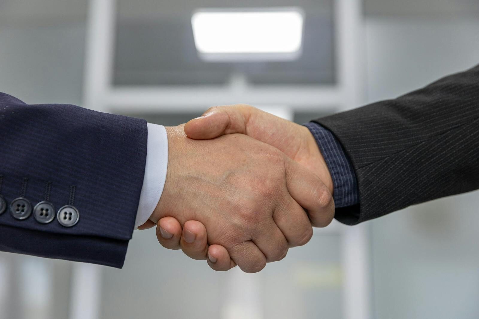 Close-up of a business handshake representing a successful partnership or agreement.